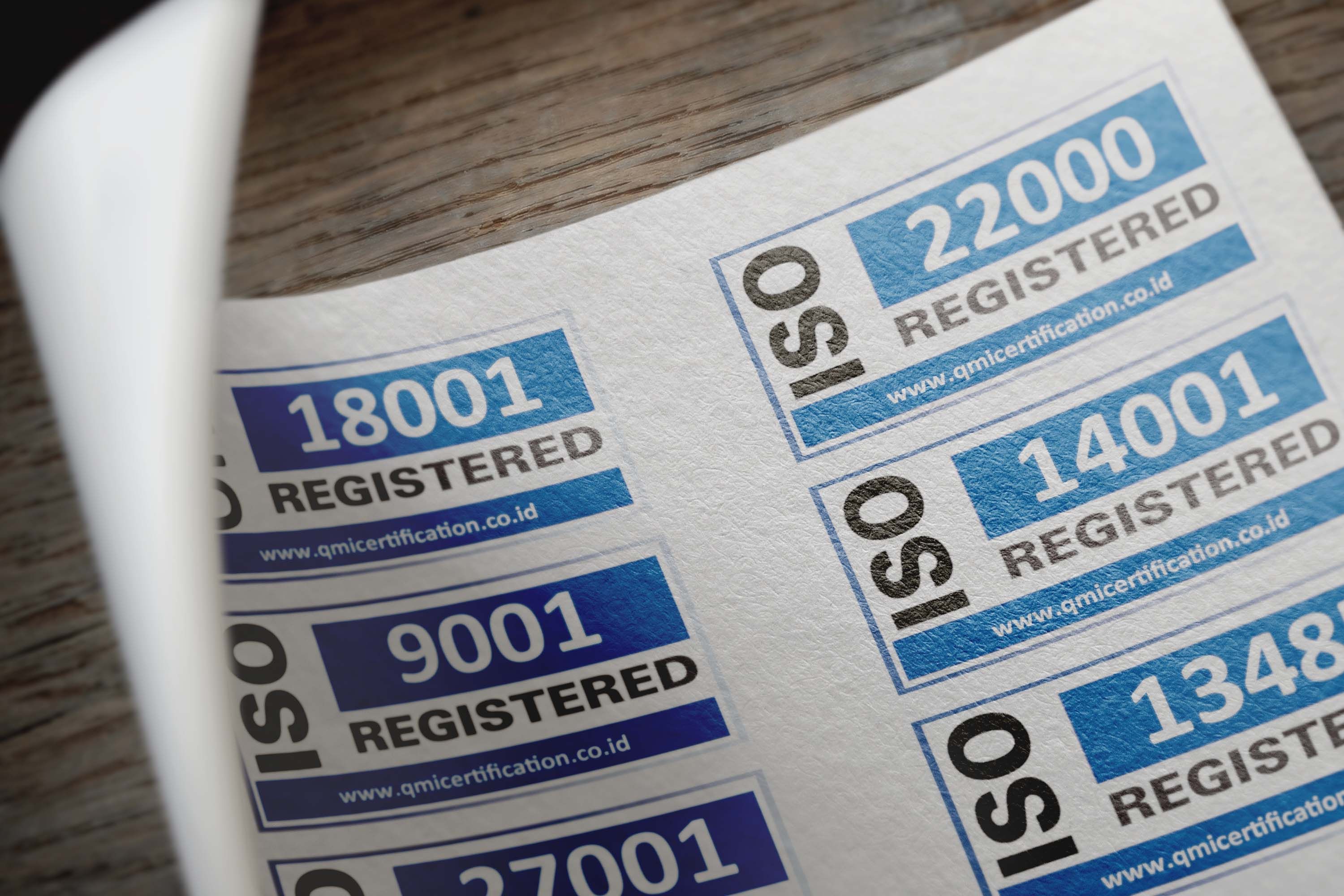 ISO-style compliance and certification labels on paper